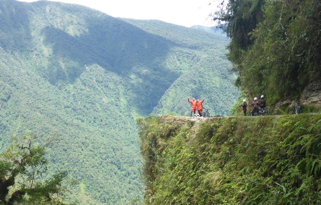 people-on-rocky-hill-viewing-mountain-during-daytime-3s3cia3pxby
